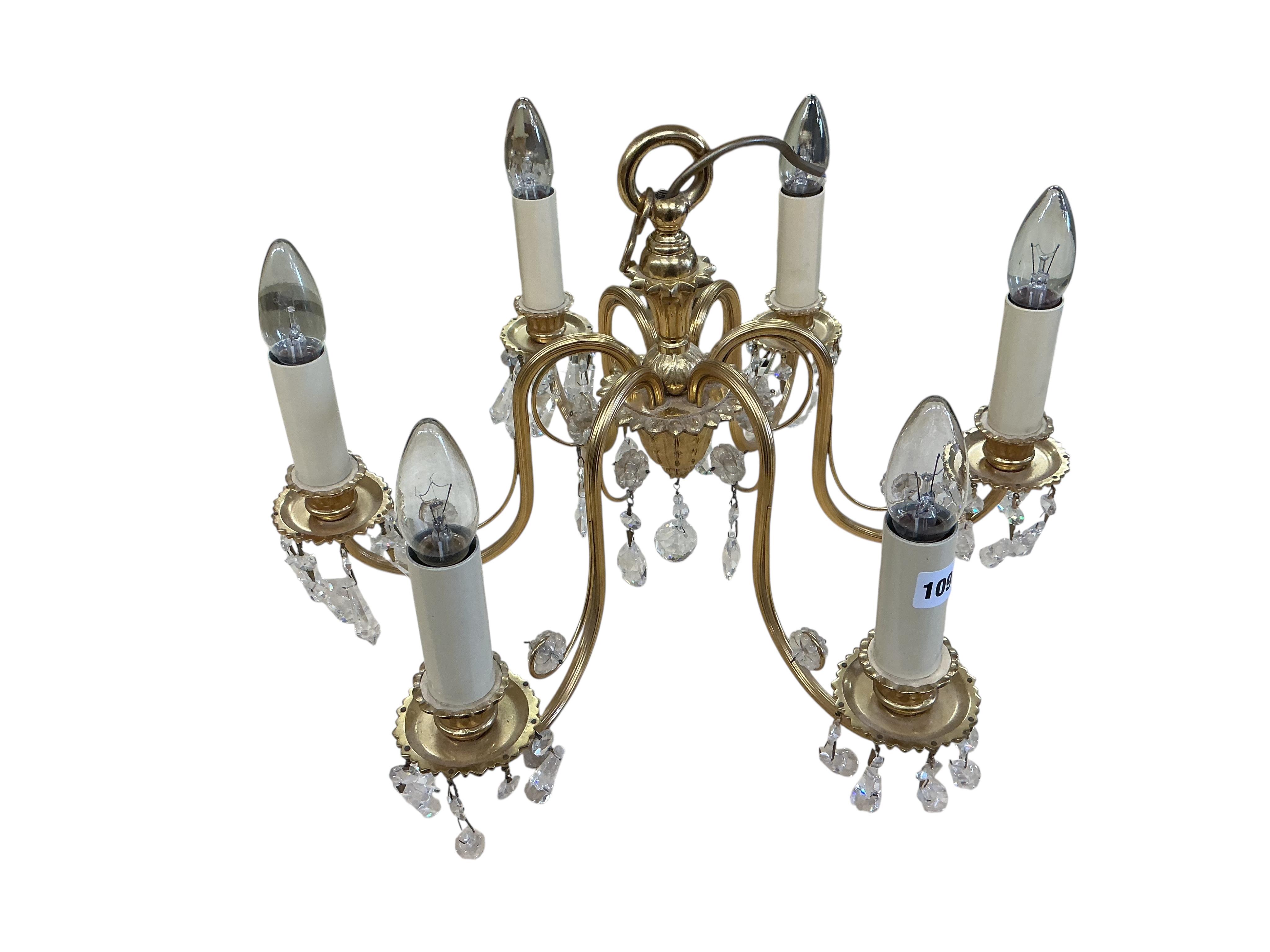 A brass six branch electrolier hung faceted glass drops, height 30cm.
